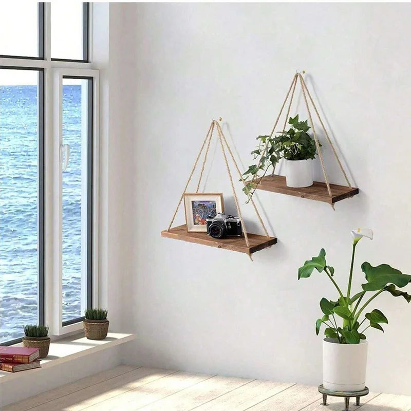 Wooden hanging swing shelf with rope for plants and décor.