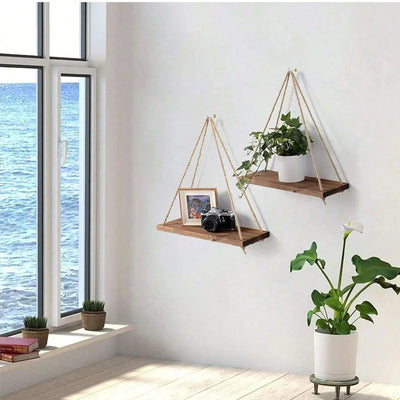 Wooden hanging swing shelf with rope for plants and décor.