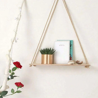 Wooden hanging swing shelf with rope for plants and décor.