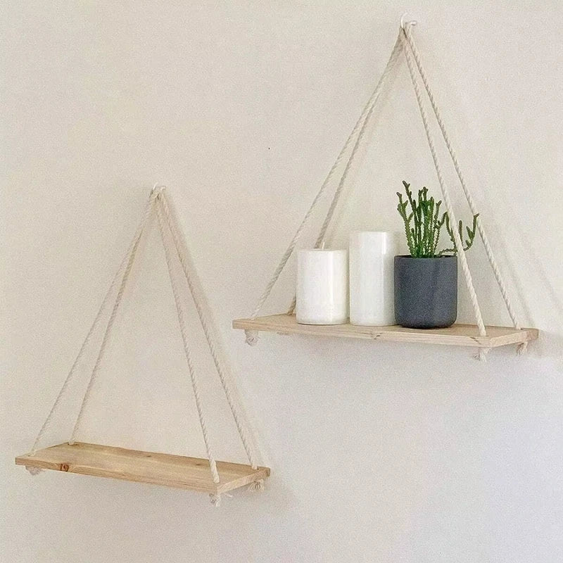 Wooden hanging swing shelf with rope for plants and décor.