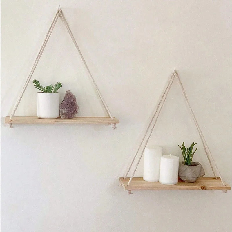 Wooden hanging swing shelf with rope for plants and décor.