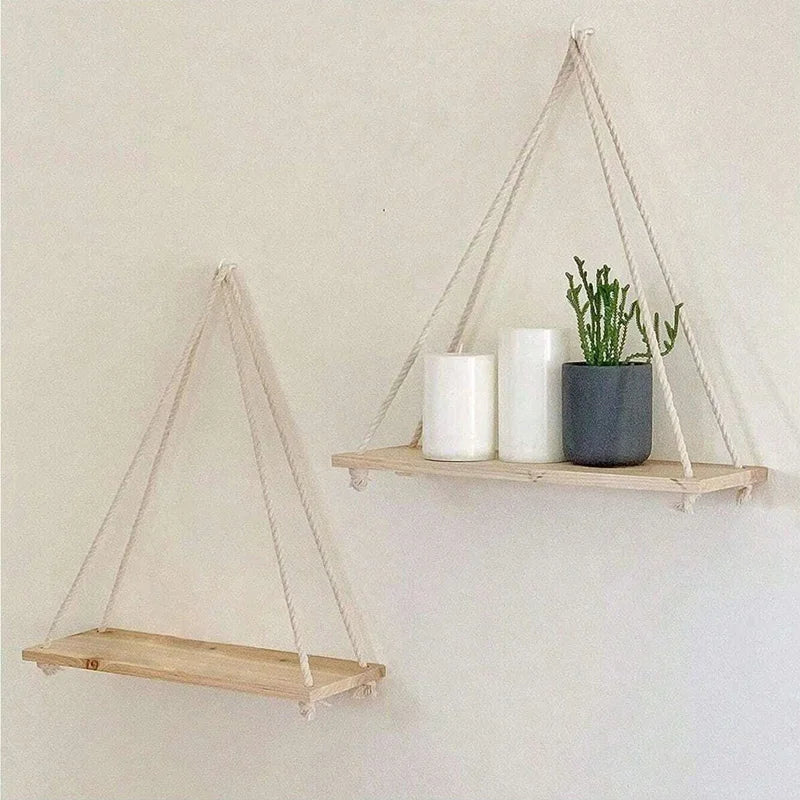 Wooden hanging swing shelf with rope for plants and décor.