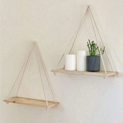 Wooden hanging swing shelf with rope for plants and décor.